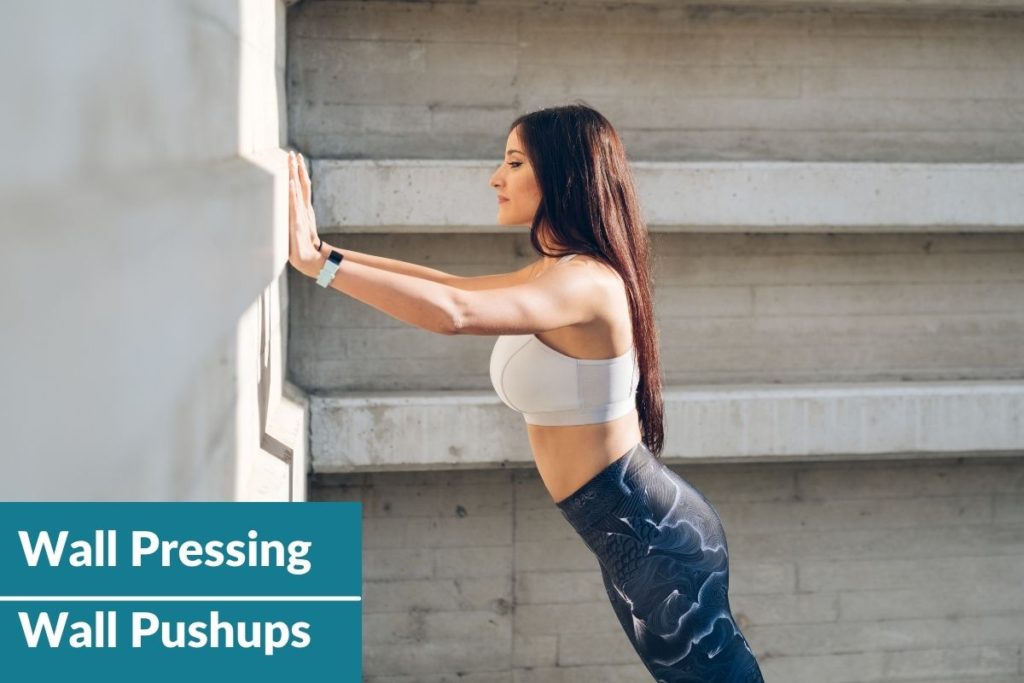 Image showing wall pressing pose or wall pushups